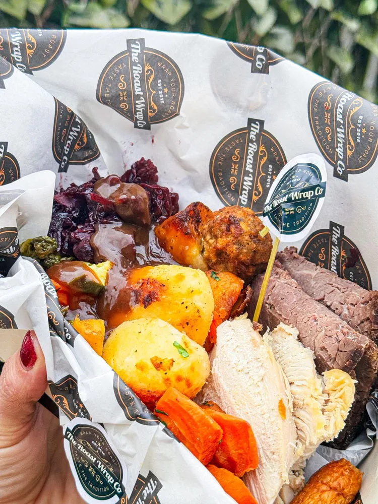 A branded platter filled with roast meats and vegetables